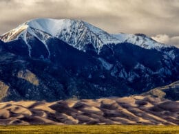 Sand dunes in front of mountains