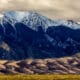 Sand dunes in front of mountains