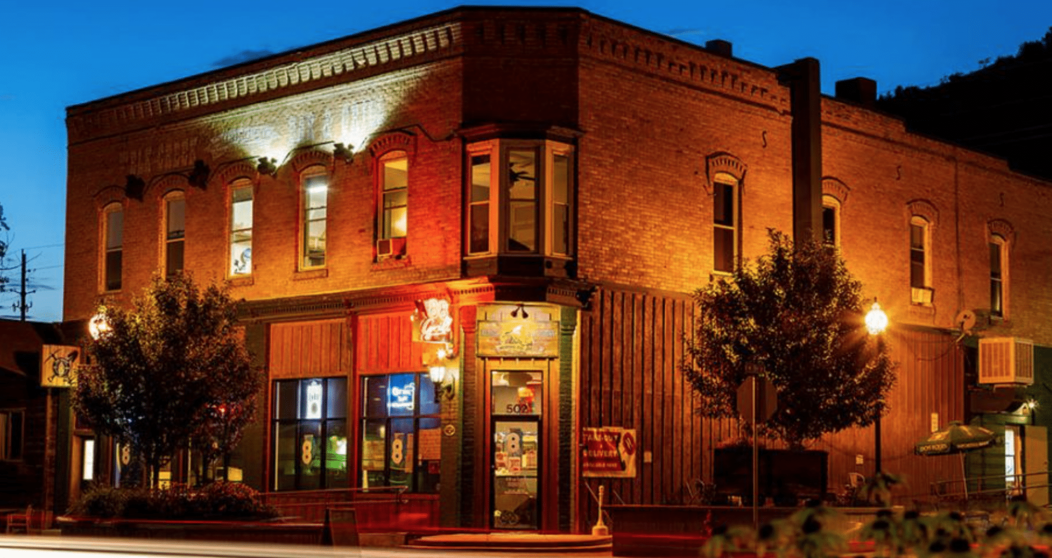 Historic Inn with lights at dusk in New Castle, CO