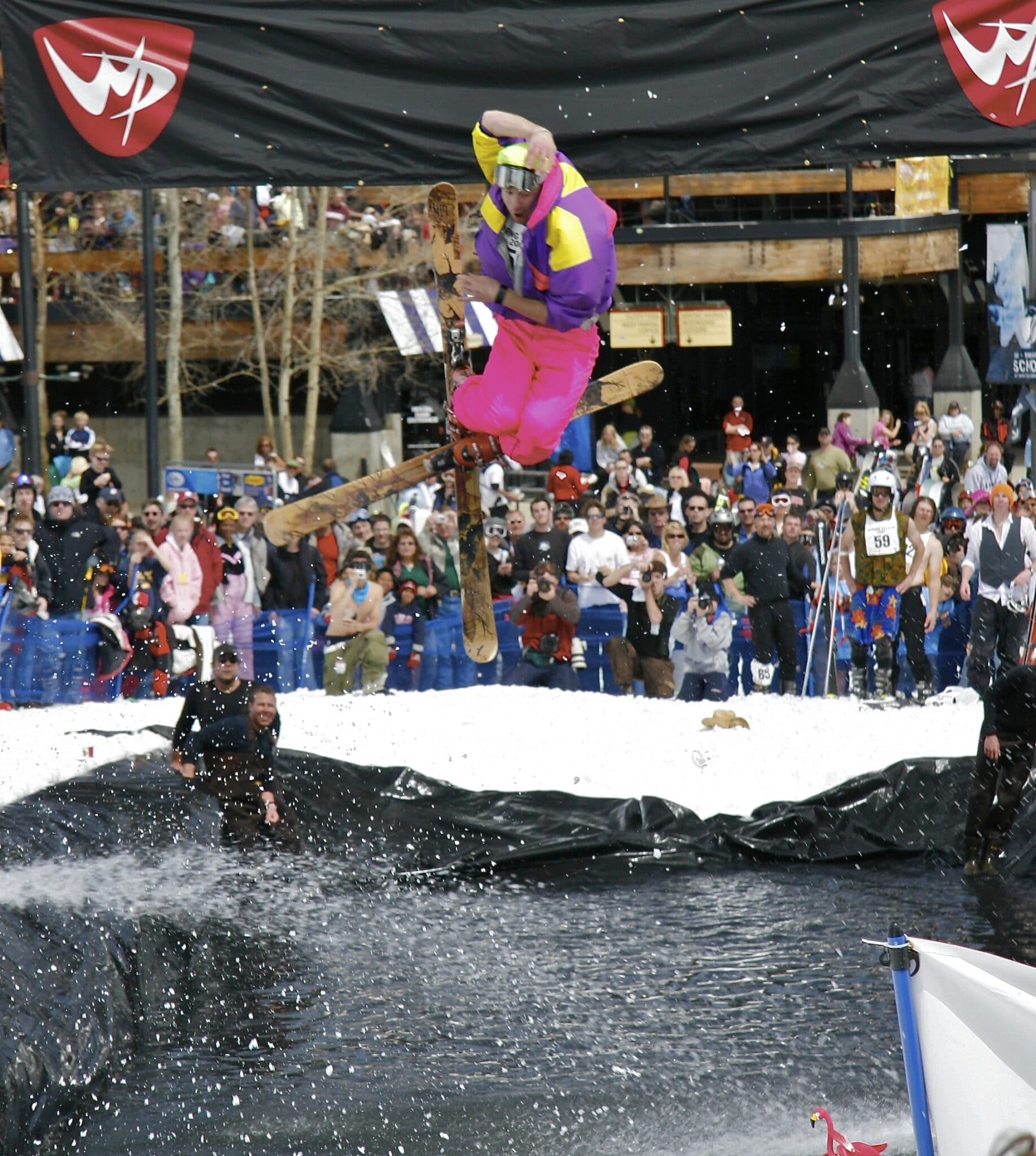 Skiier over pond