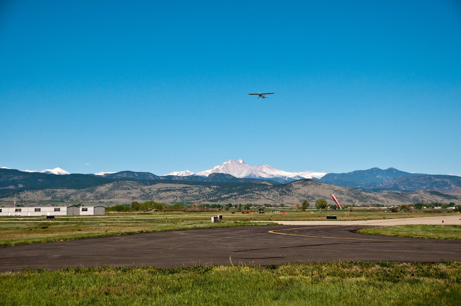 Image of plane landing at Vance Brand Airport in Longmont, Colorado