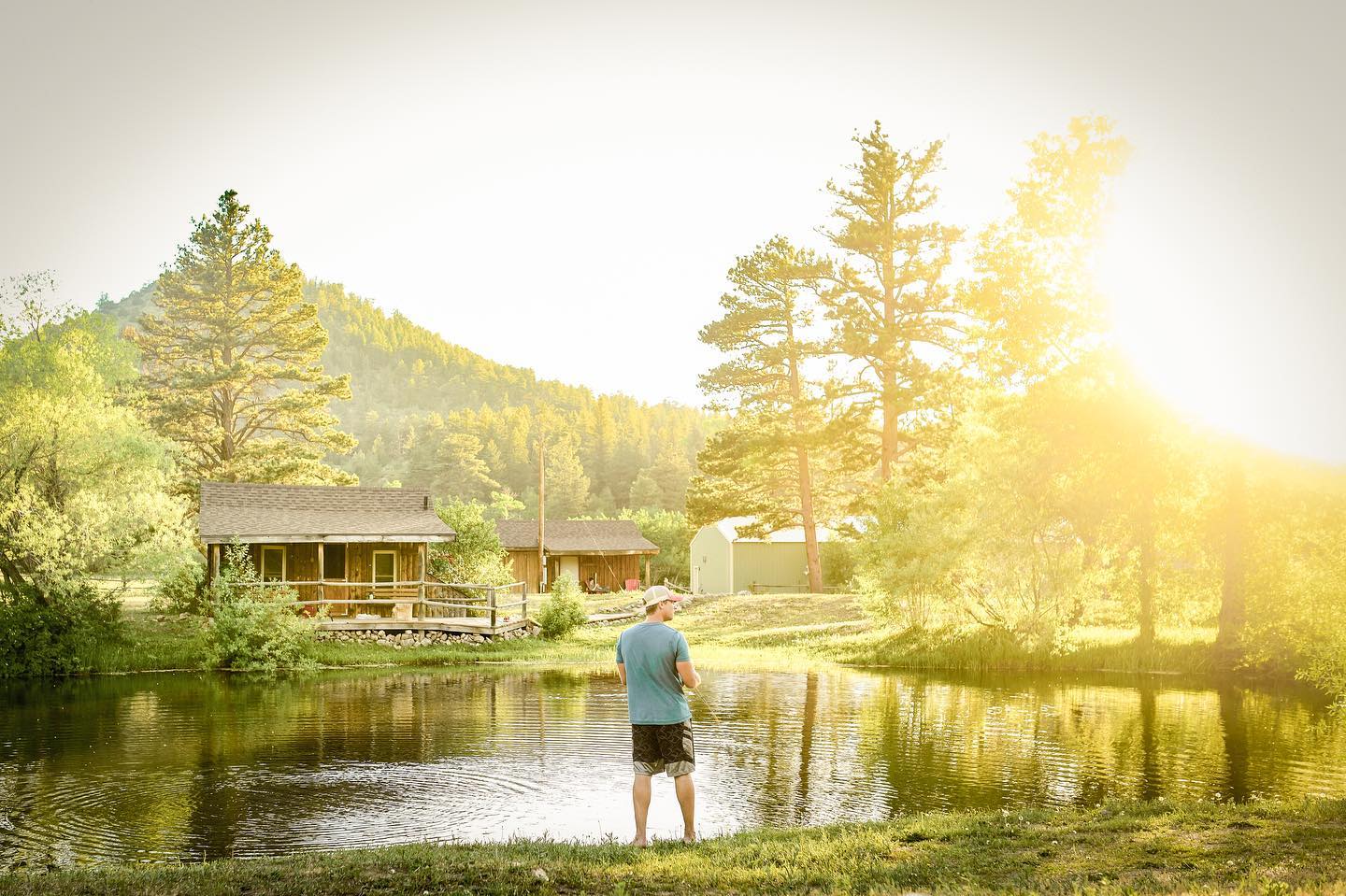 Person fishing in a pond