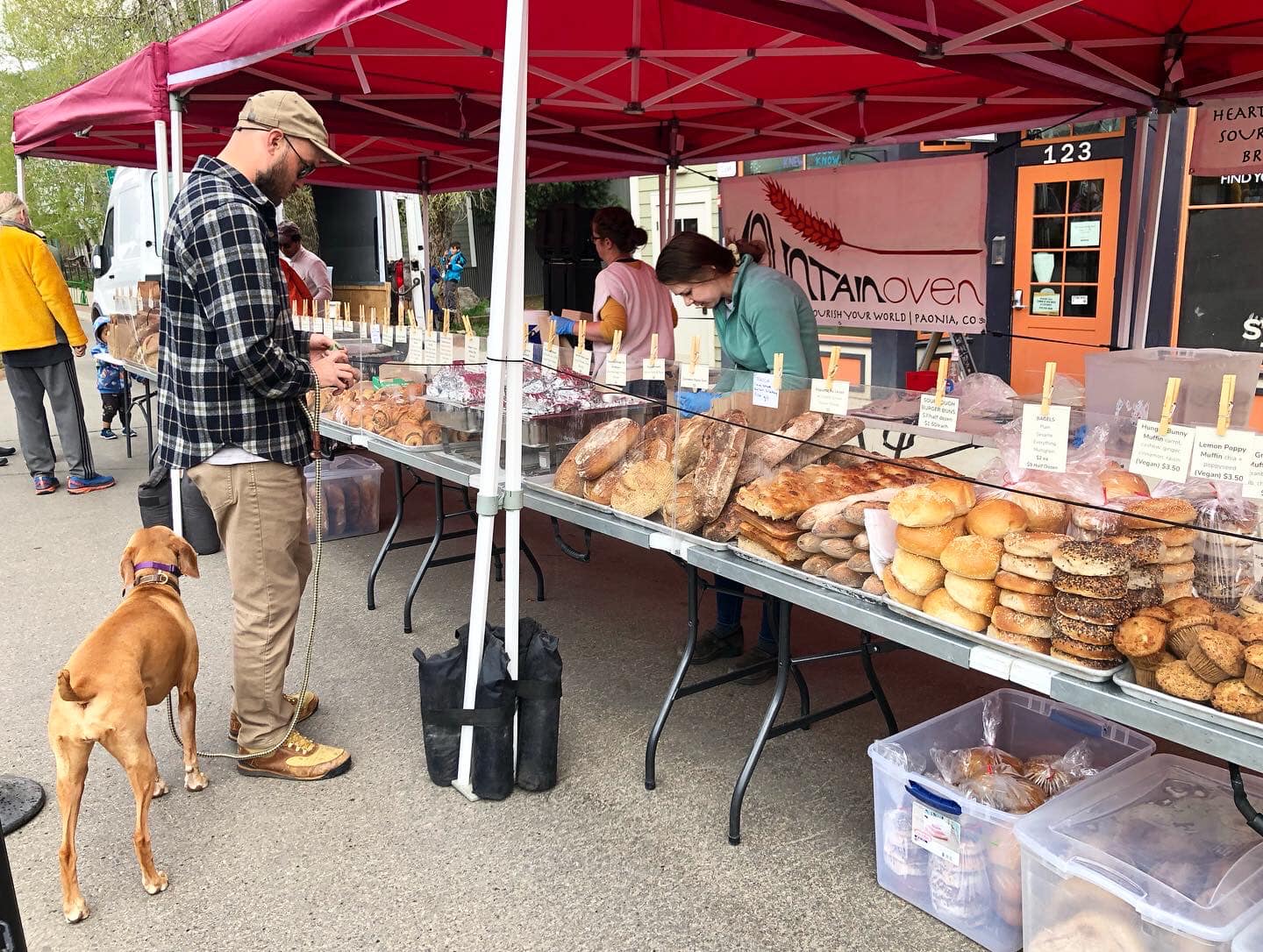 Image of a man and dog at Mountain Oven at the Crested Butte Farmers Market