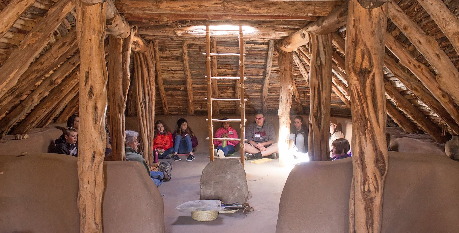 Image of people in the Pithouse Learning Center at the Crow Canyon Archaeological Center in Colorado