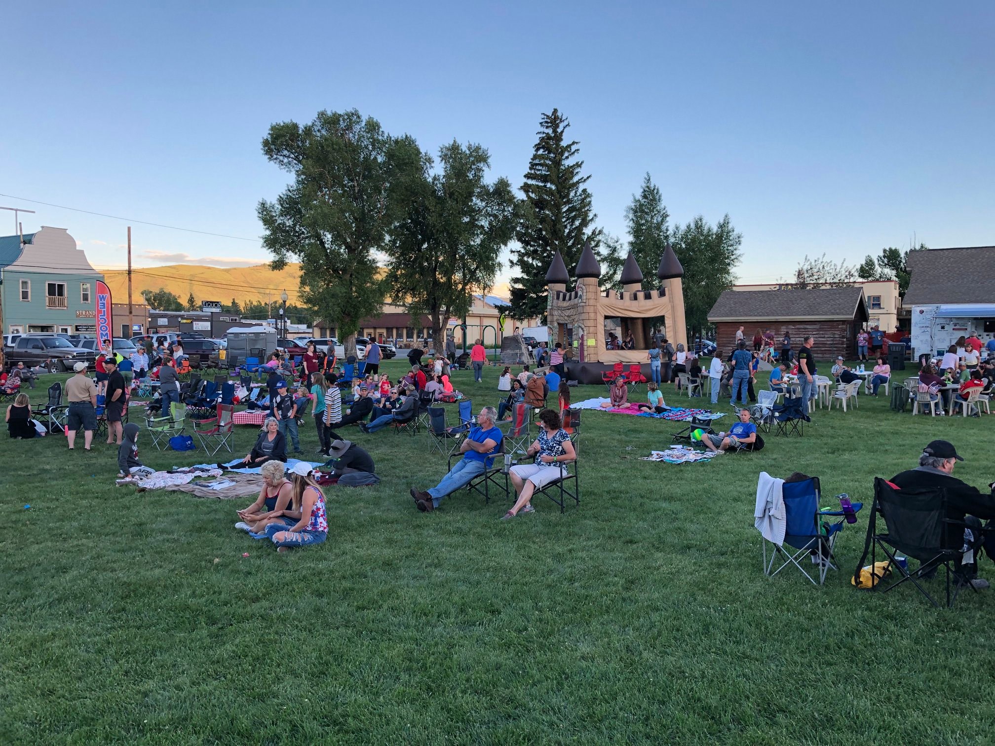 Group of people sitting on lawn