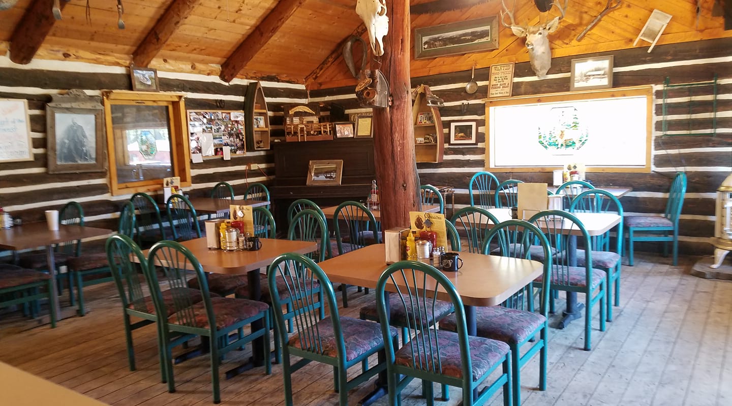 Interior of a restaurant with log-cabin decor