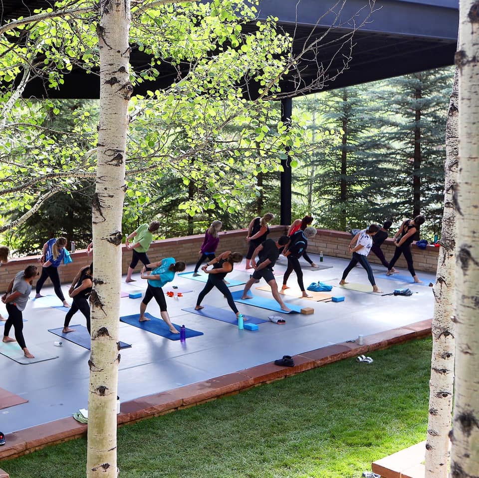 Group of people doing yoga outside