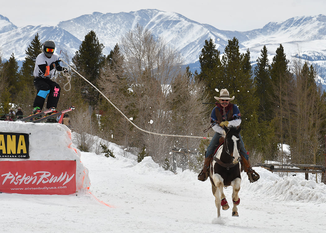 Ski joring horseback rider and skiier