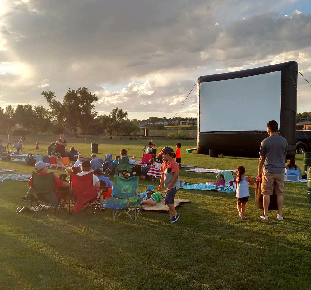 Outdoor movie screen at dusk