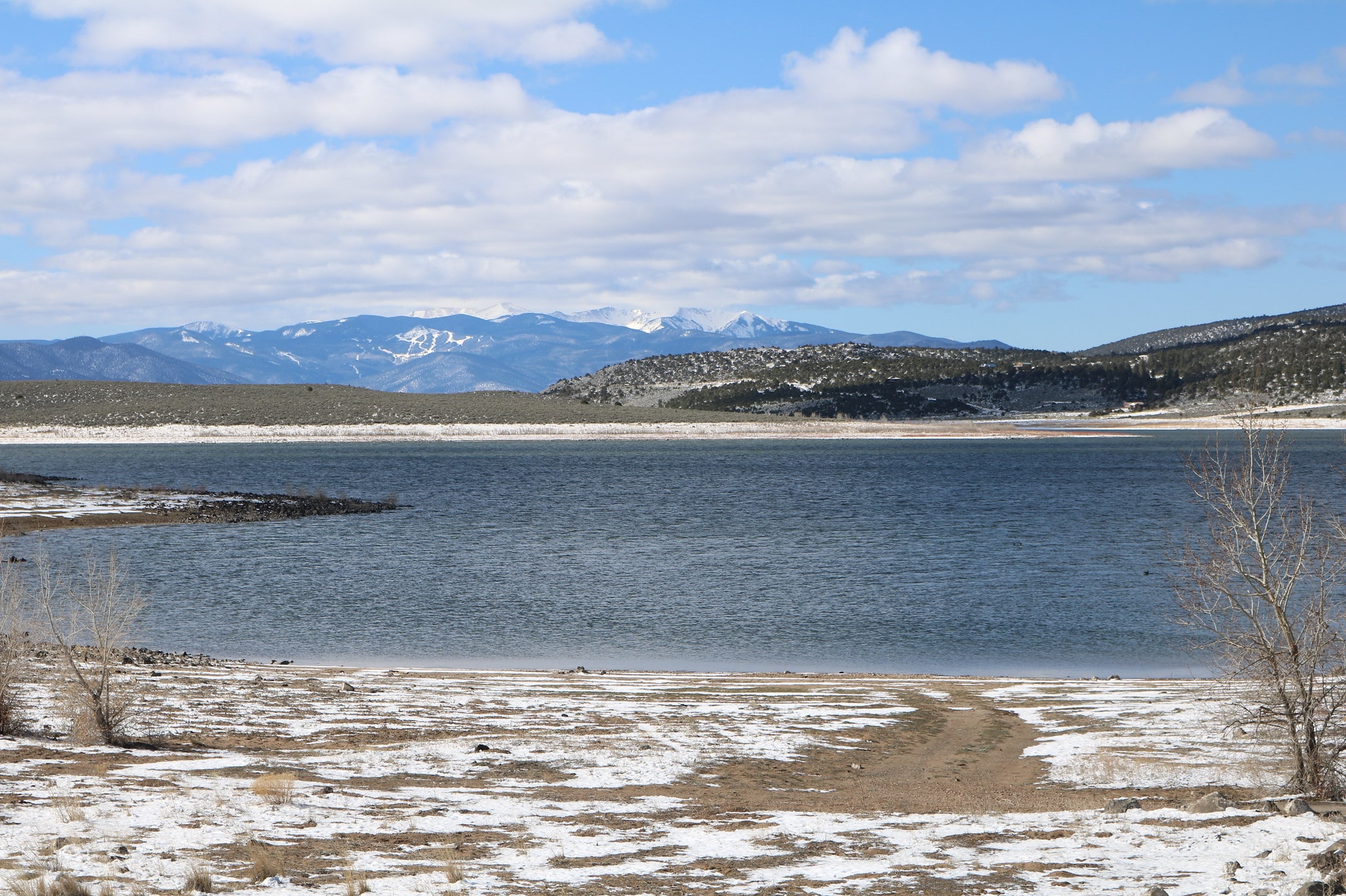 Reservoir with mountain range in the background