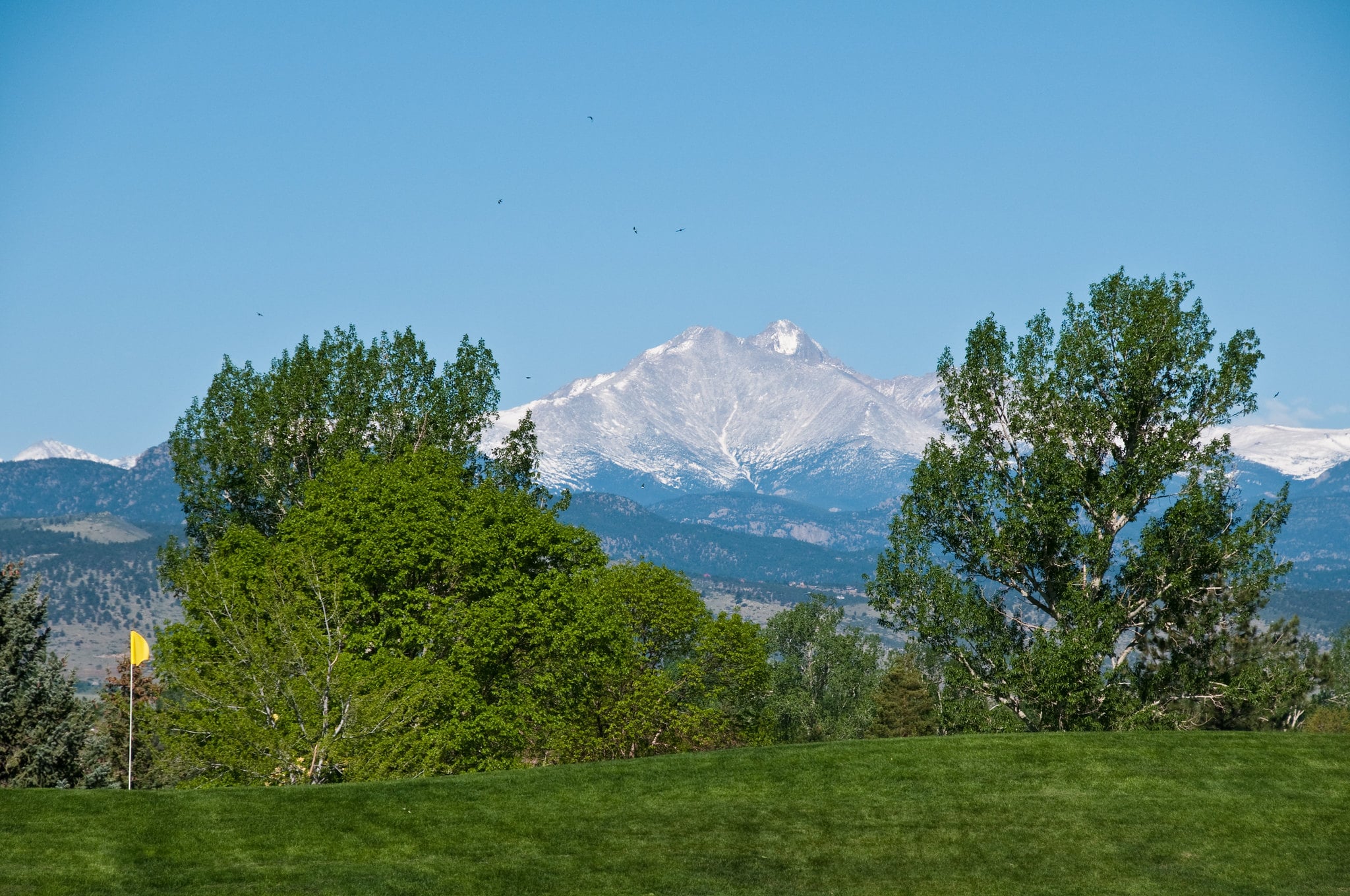 Mountains behind a golf course