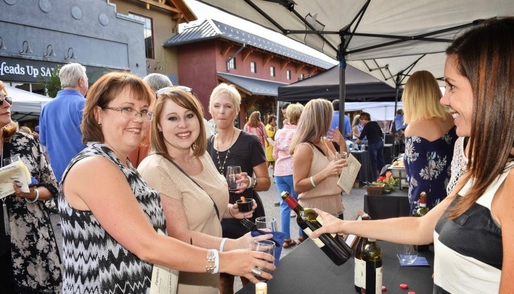 2 people at a wine tasting table