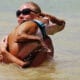 Boulder Reservoir Colorado Lady swimming holding a dog