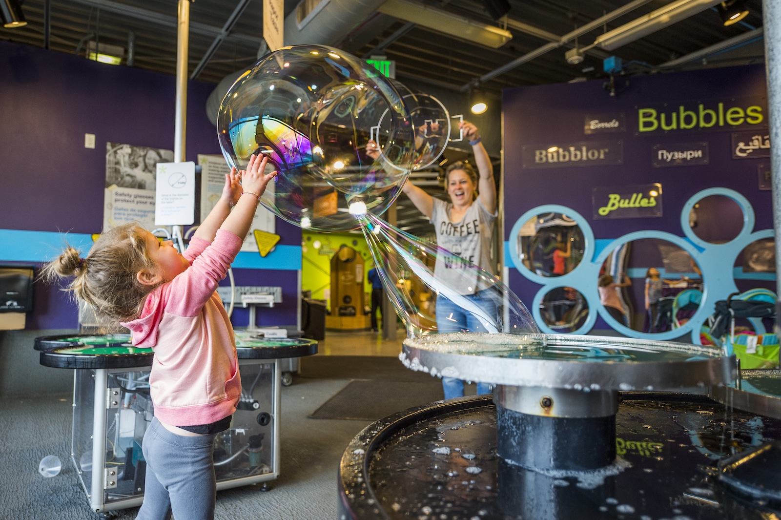 Image of a child playing with bubbles at Investigate exhibit at the Children's Museum of Denver Marsico Campus in Colorado