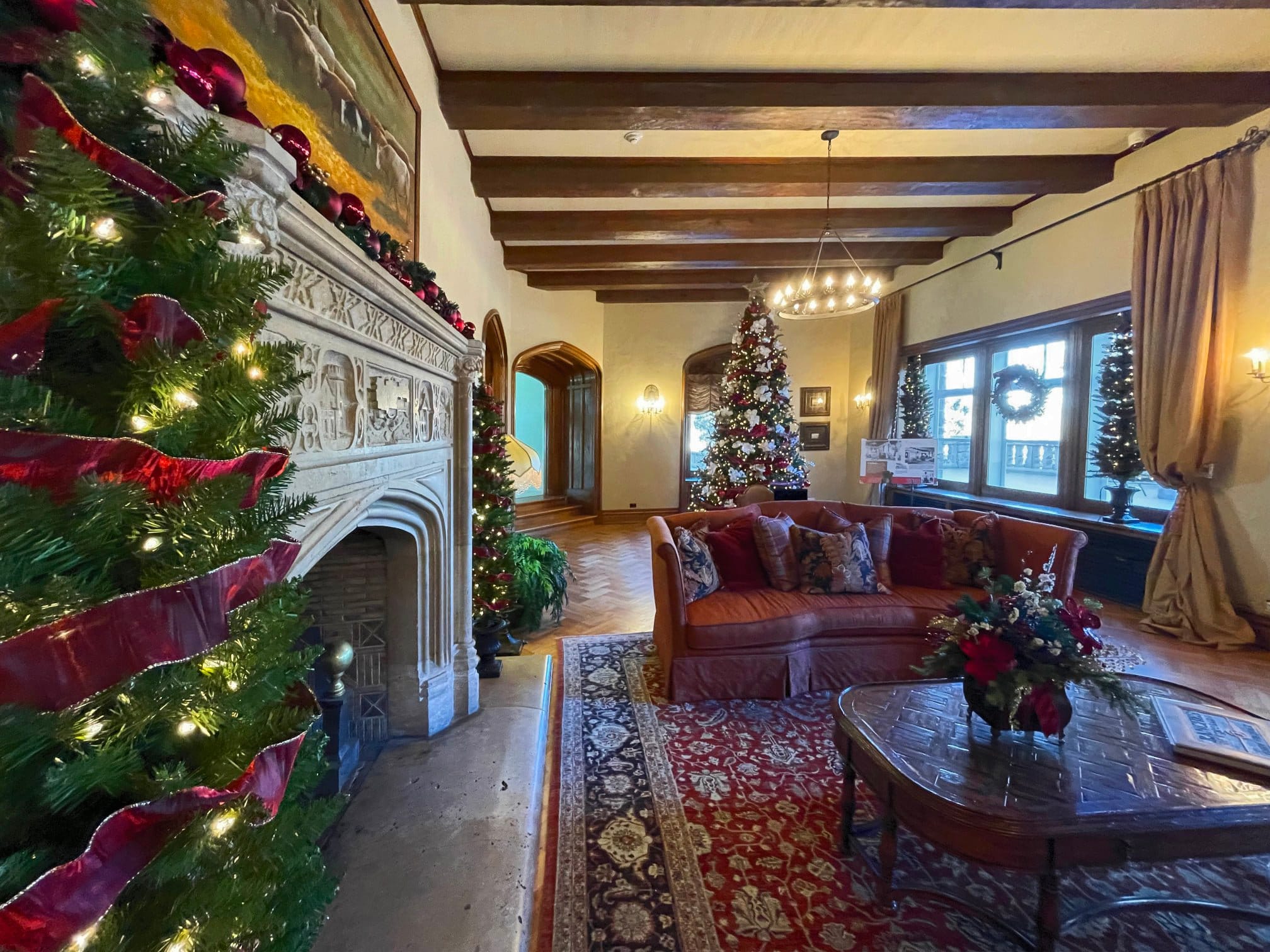 Inside of mansion decorated for the holiday season