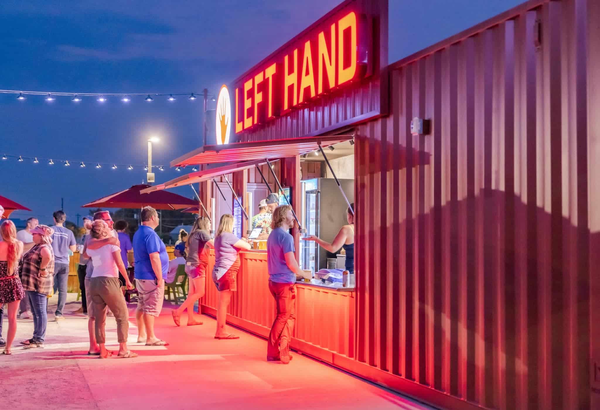 Beer garden bar with illuminated red sign