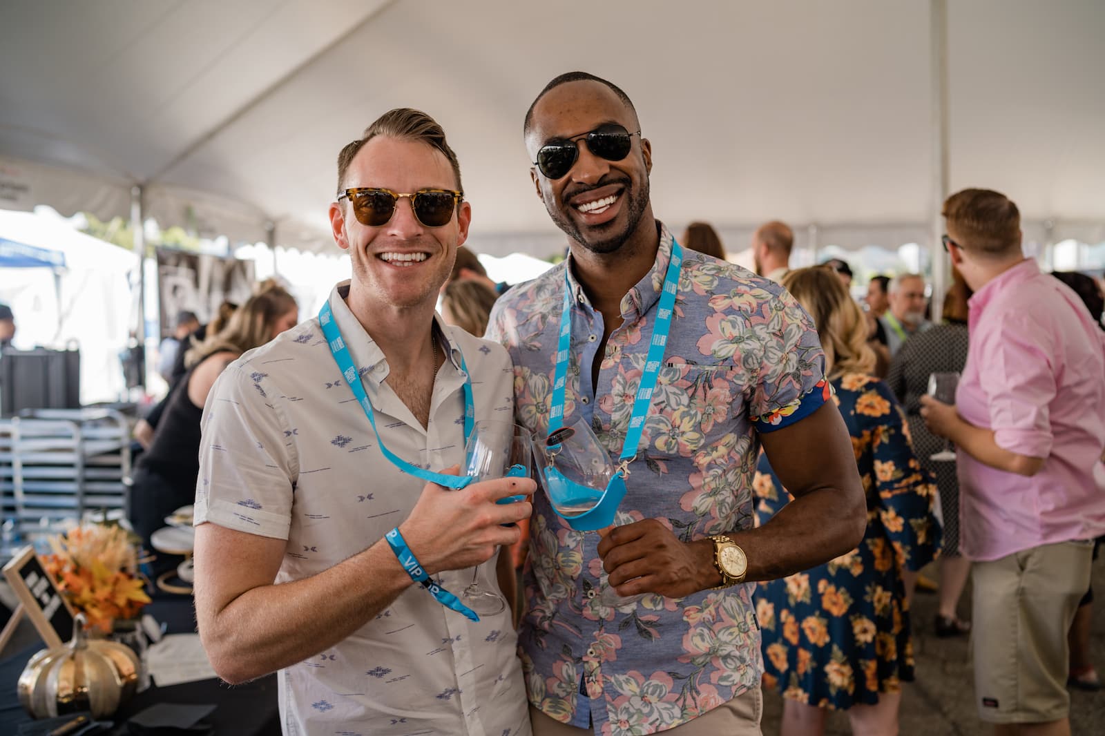 Image of people enjoying wine in their souvenir glasses at the Denver Food & Wine Festival in Colorado