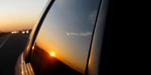 Driving to Denver Colorado Sunset reflection on passenger window