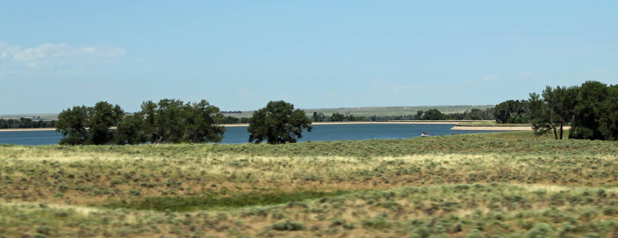 Reservoir surrounded by grassland