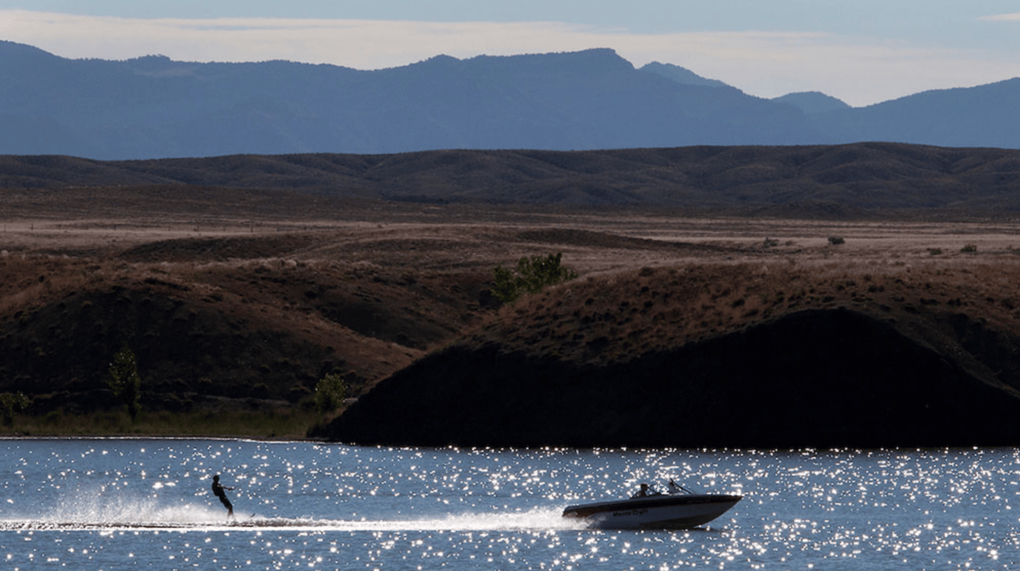 Waterskier behind a boat on a lake