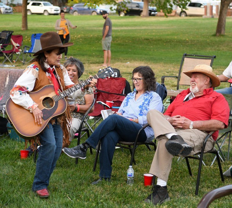 Western music performer interacting with crowd