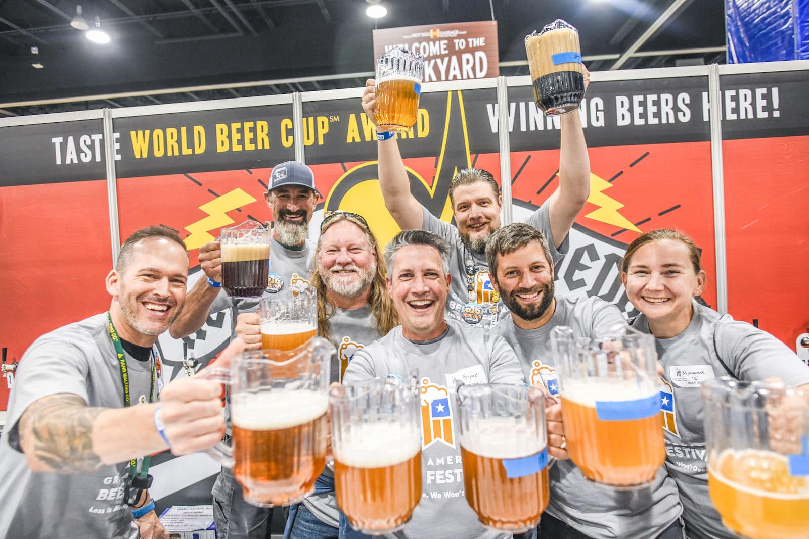 Image of people drinking beer pitchers at the Great American Beer Festival in Denver, Colorado