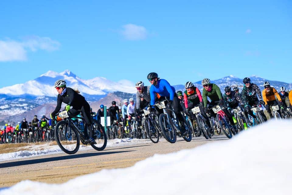 group of bikers on snowy track