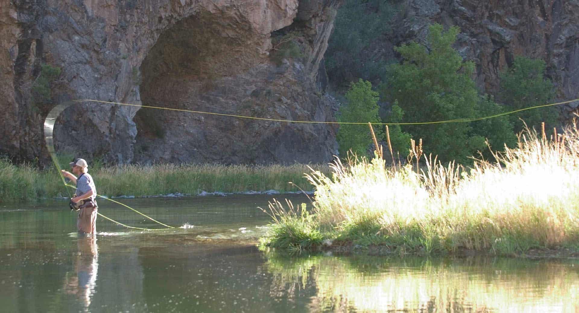 Fly fisherman casting a line