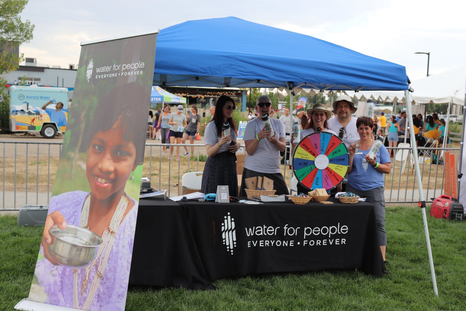 Water for People volunteers collect donations and educate festival attendees about the nonprofit's work.