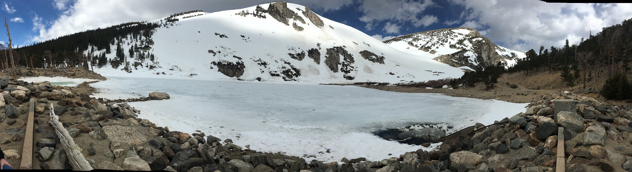 Snow covering glacier and frozen pond