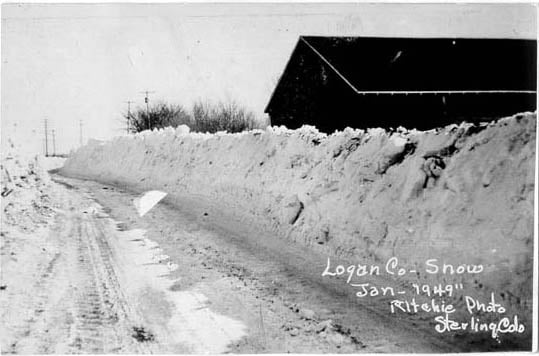 Sterling CO Blizzard 1949 Snow covered road with high wall of snow