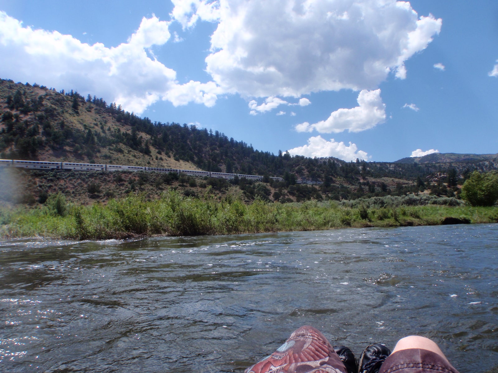 Tuber floating down the Colorado River at Radium, CO