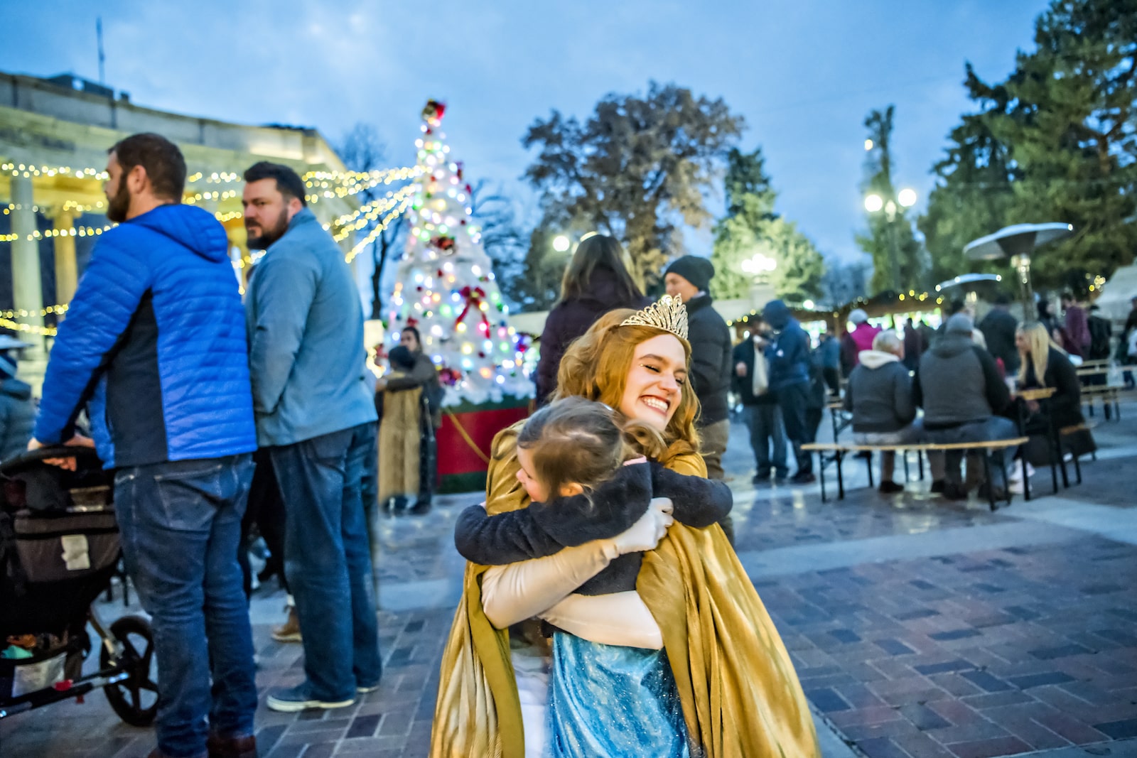 Denver Christkindlmarket little girl hugs a princess