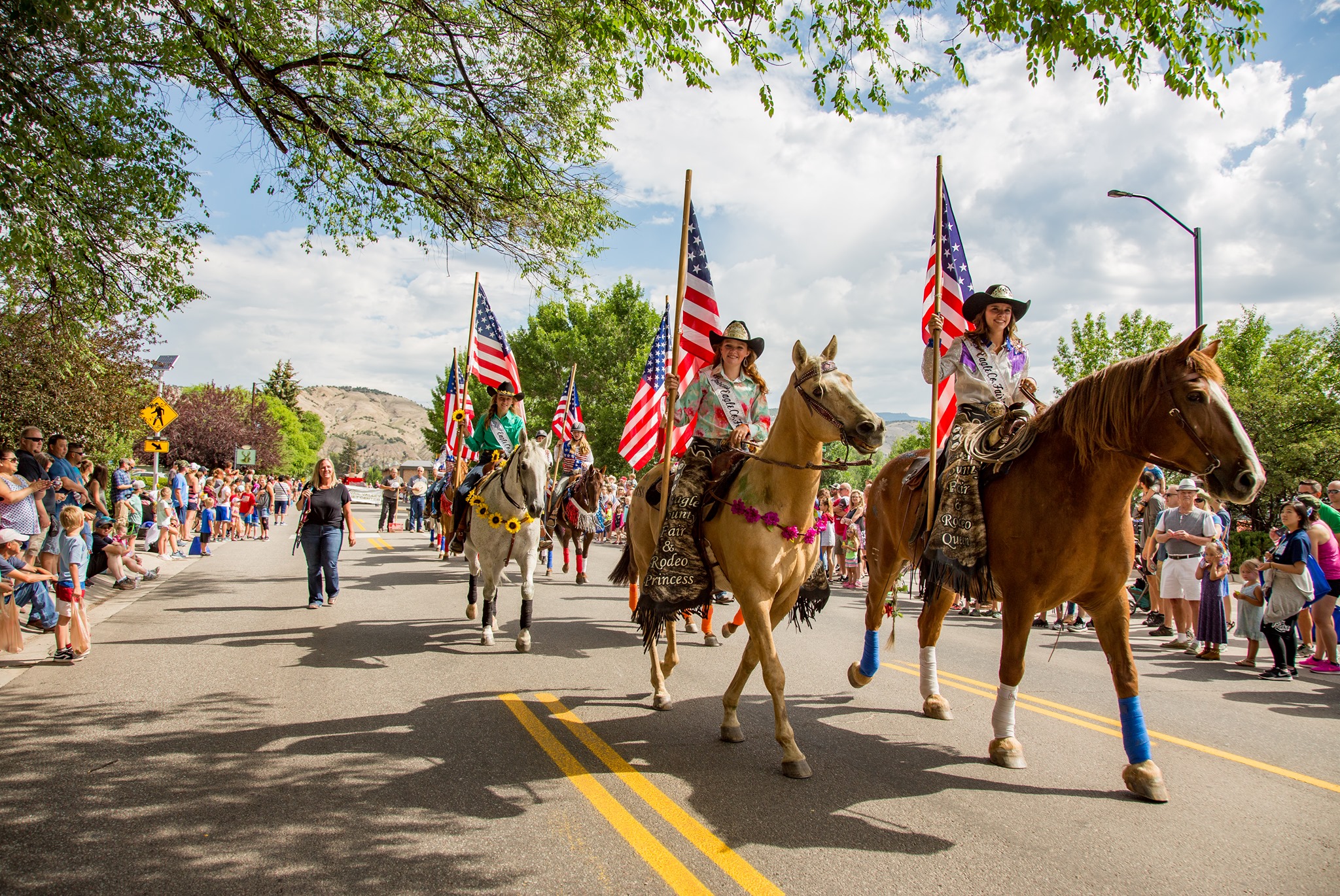 Cowgirls on horses in a parade