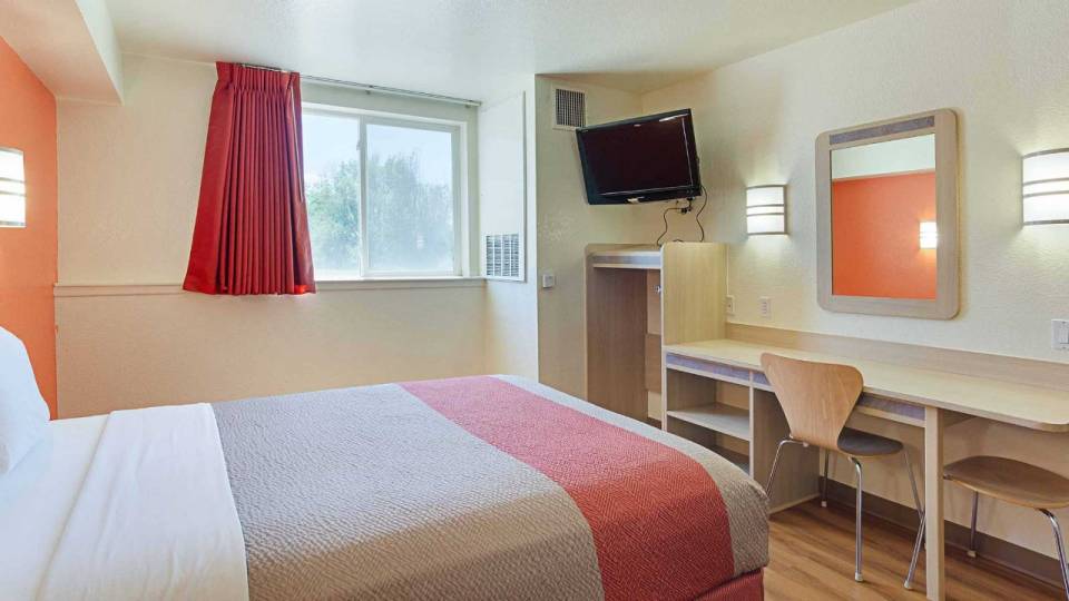 Hotel room with salmon colored decor