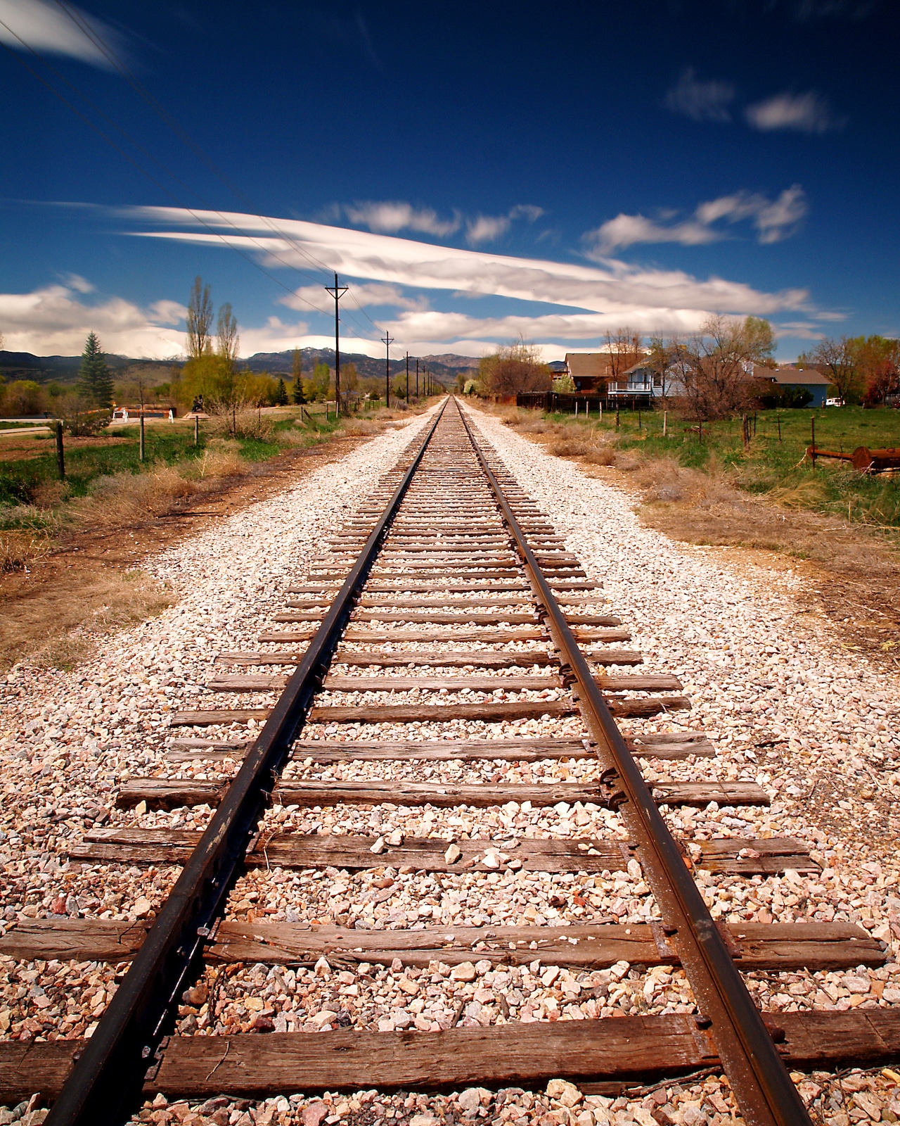 Railroad Train Tracks in Longmont, CO leading to the mountains