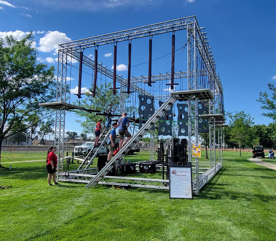 Ropes course outside in a grass field