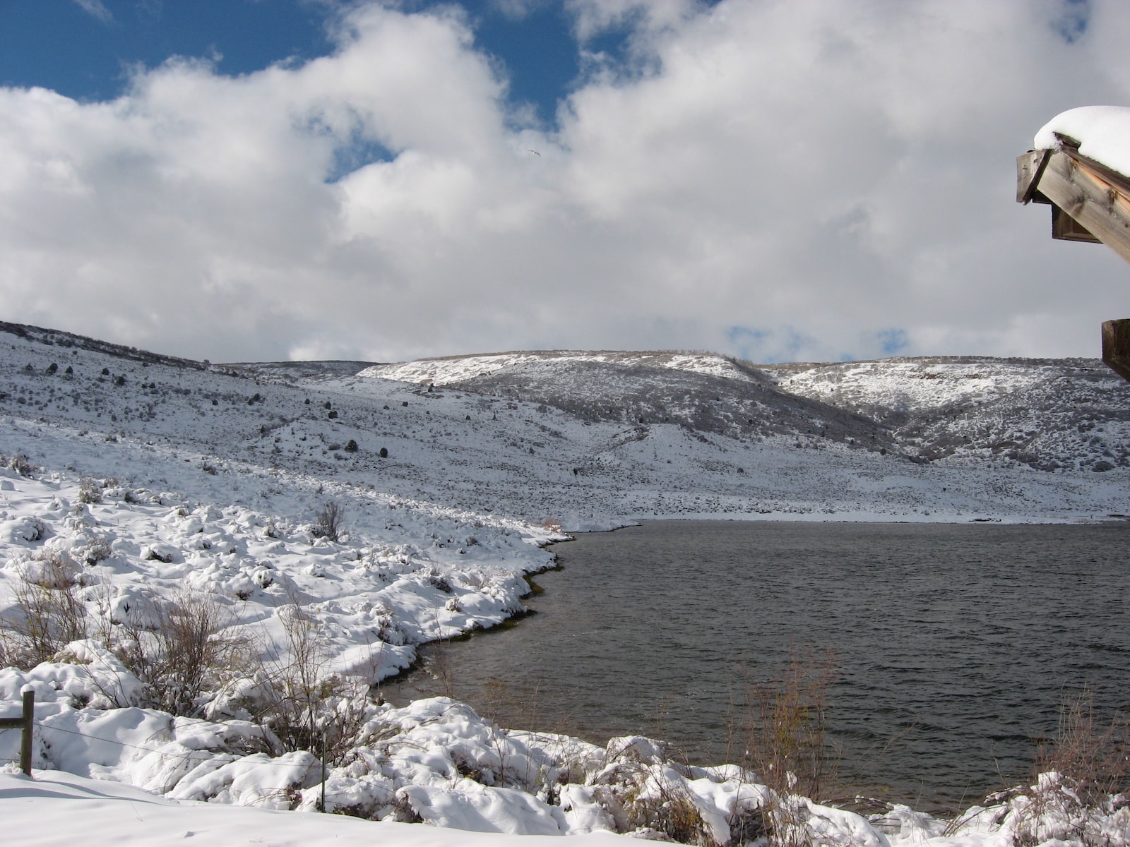 Snow around a reservoir in flat top mountains by Meeker CO