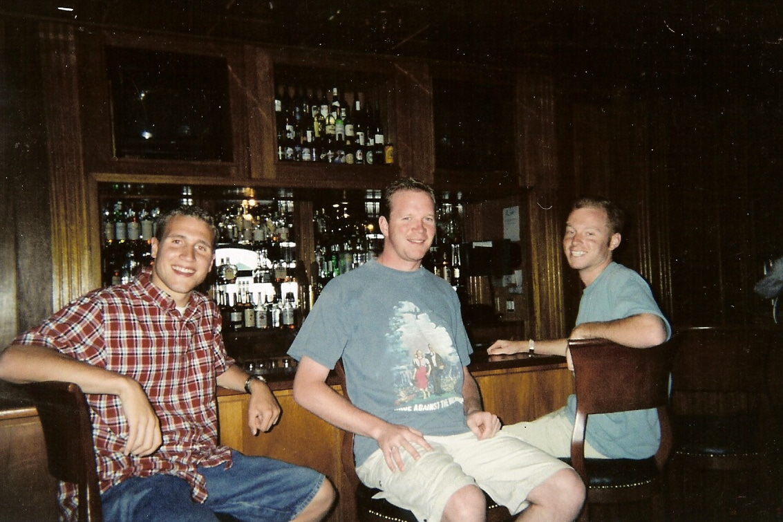 3 Guys sit at bar at Stanley Hotel Estes Park CO