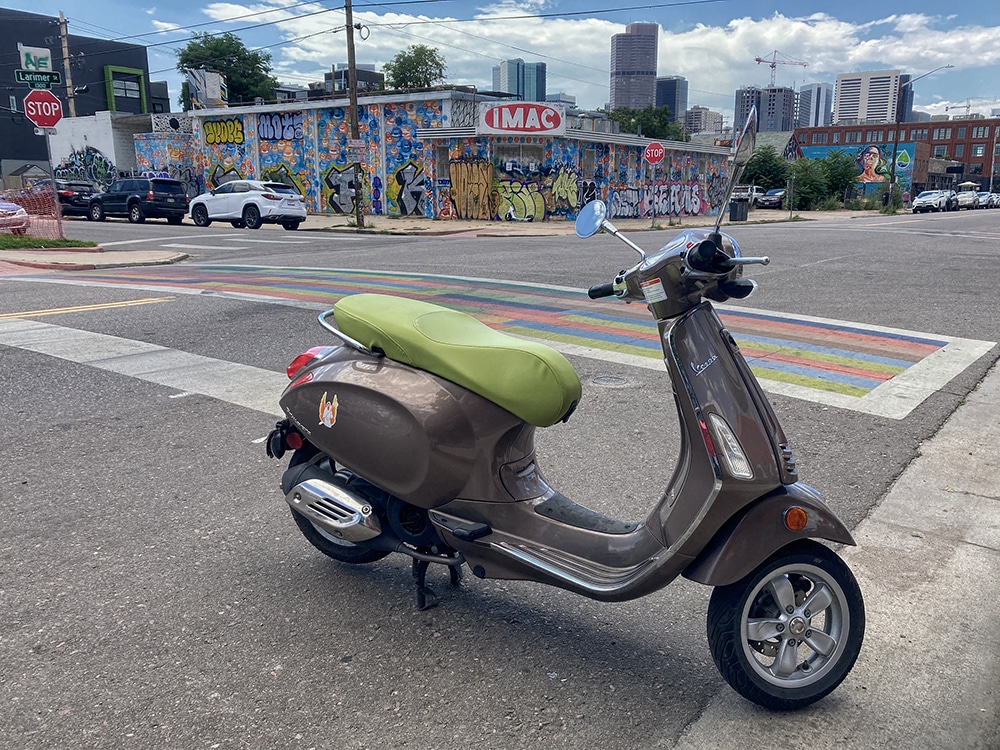 Vespa scooter parked in Five Points Denver CO