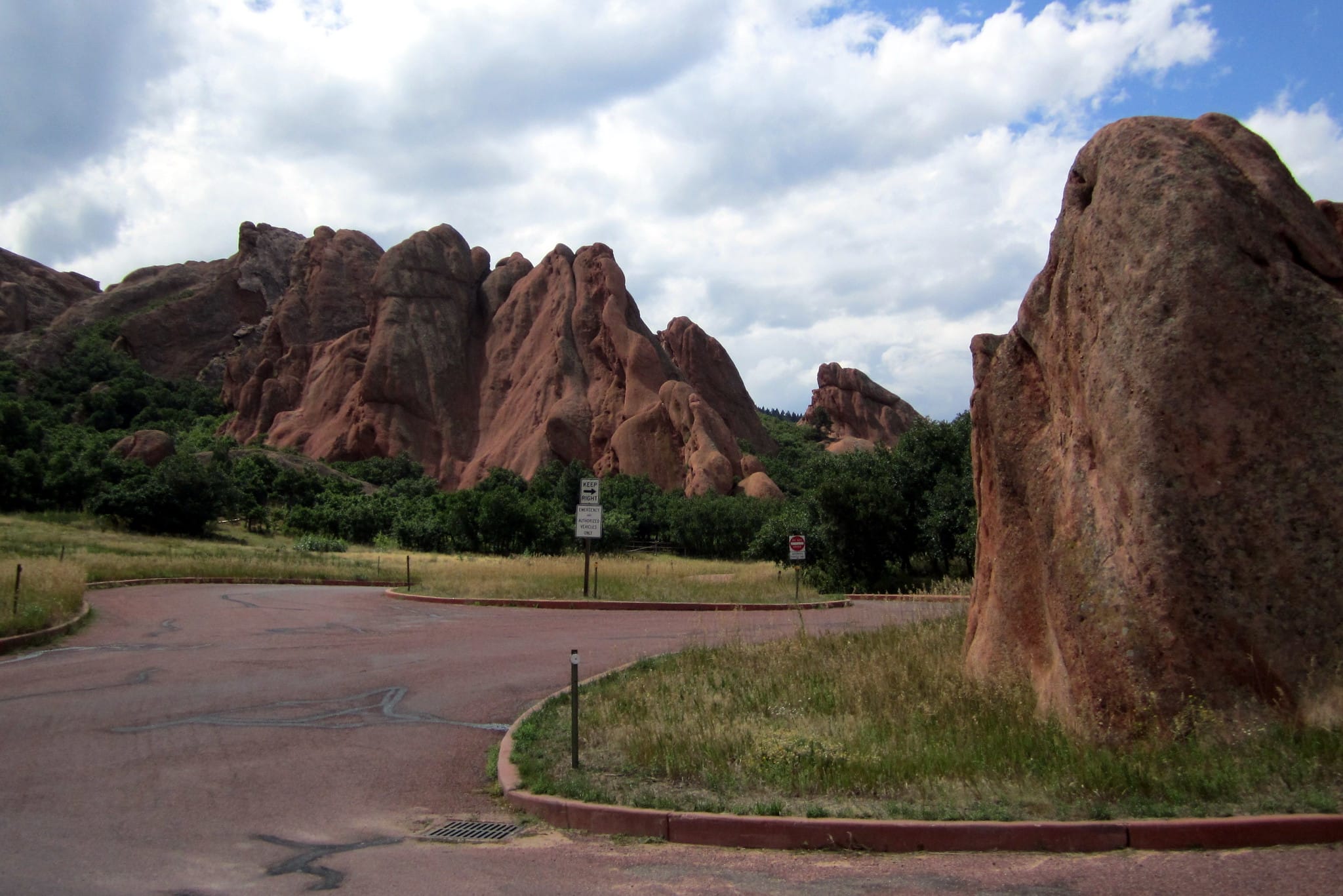 Road leading into a state park with cool rock formations