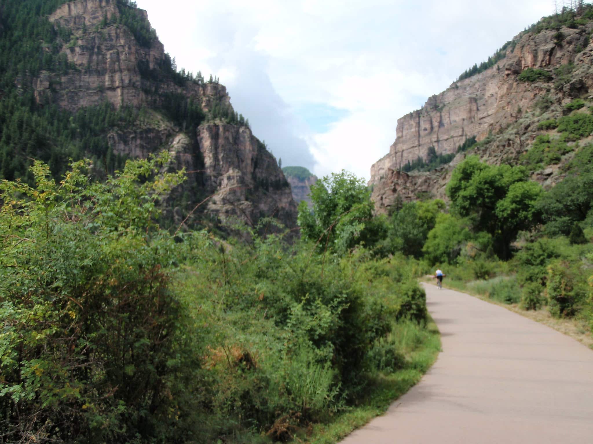 Rio Grande biking trail, a paved trail surrounded by greenery and rock walls