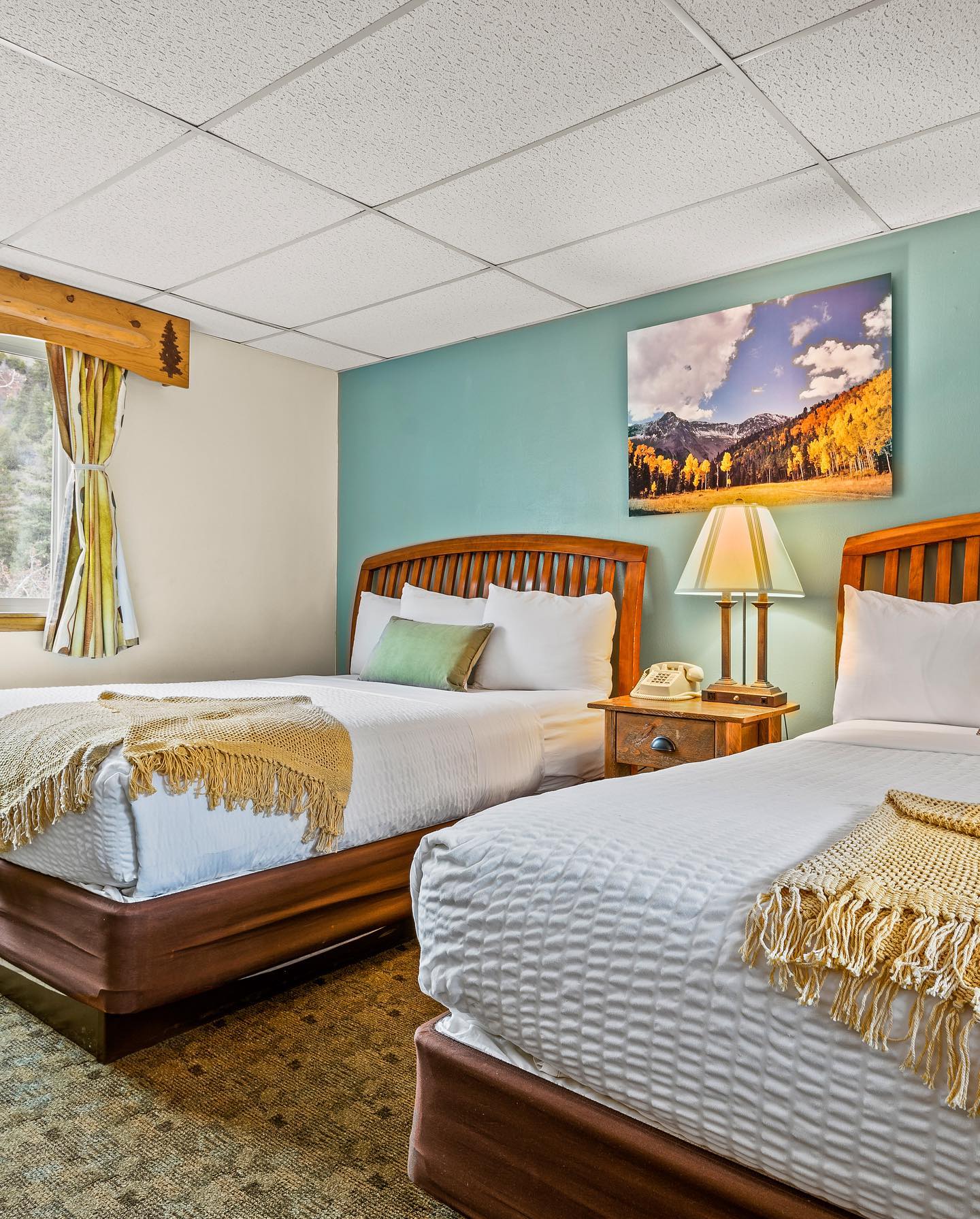 Two queen beds in a hotel room