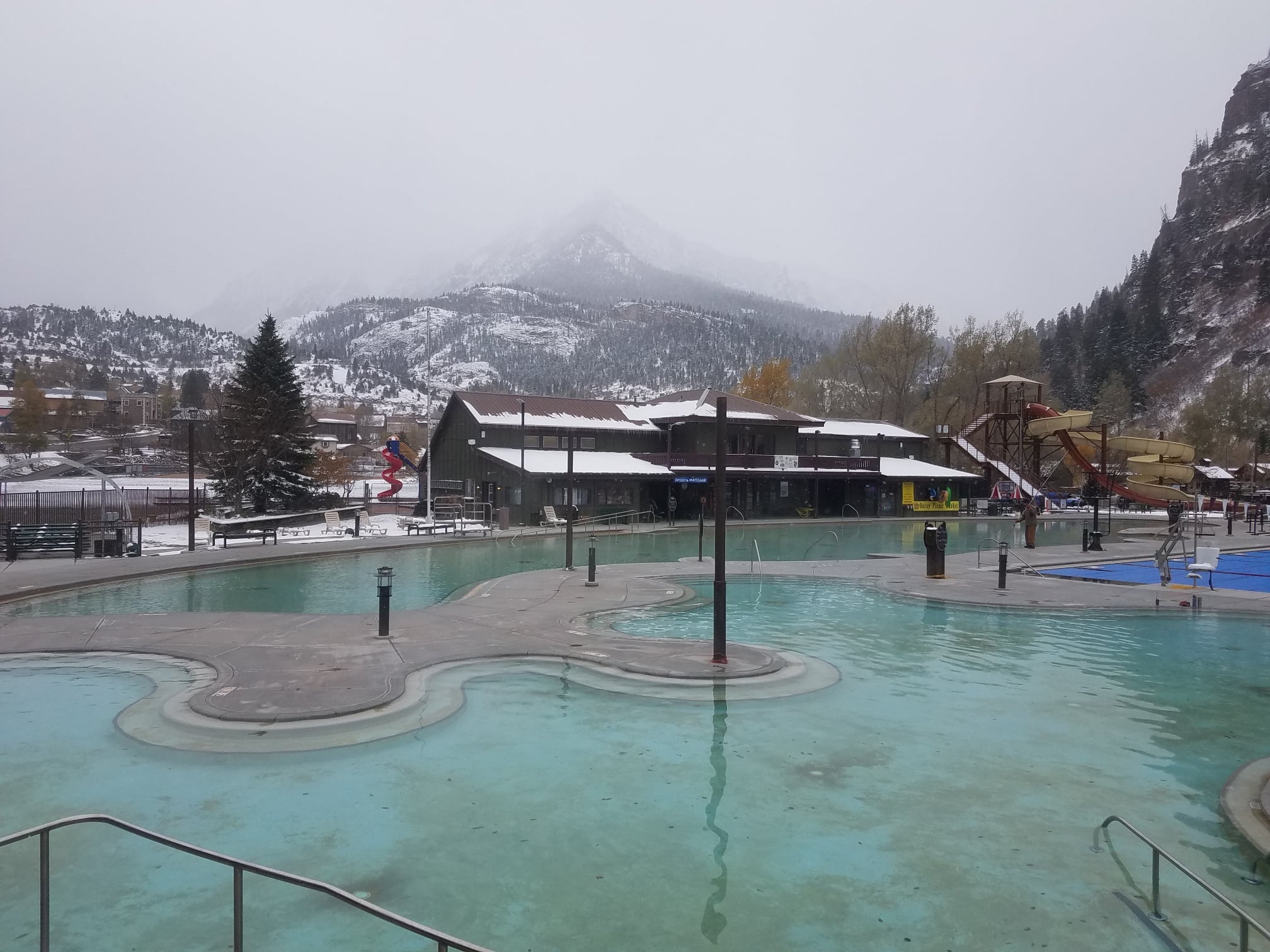 Outdoor hot springs pool on a cloudy day