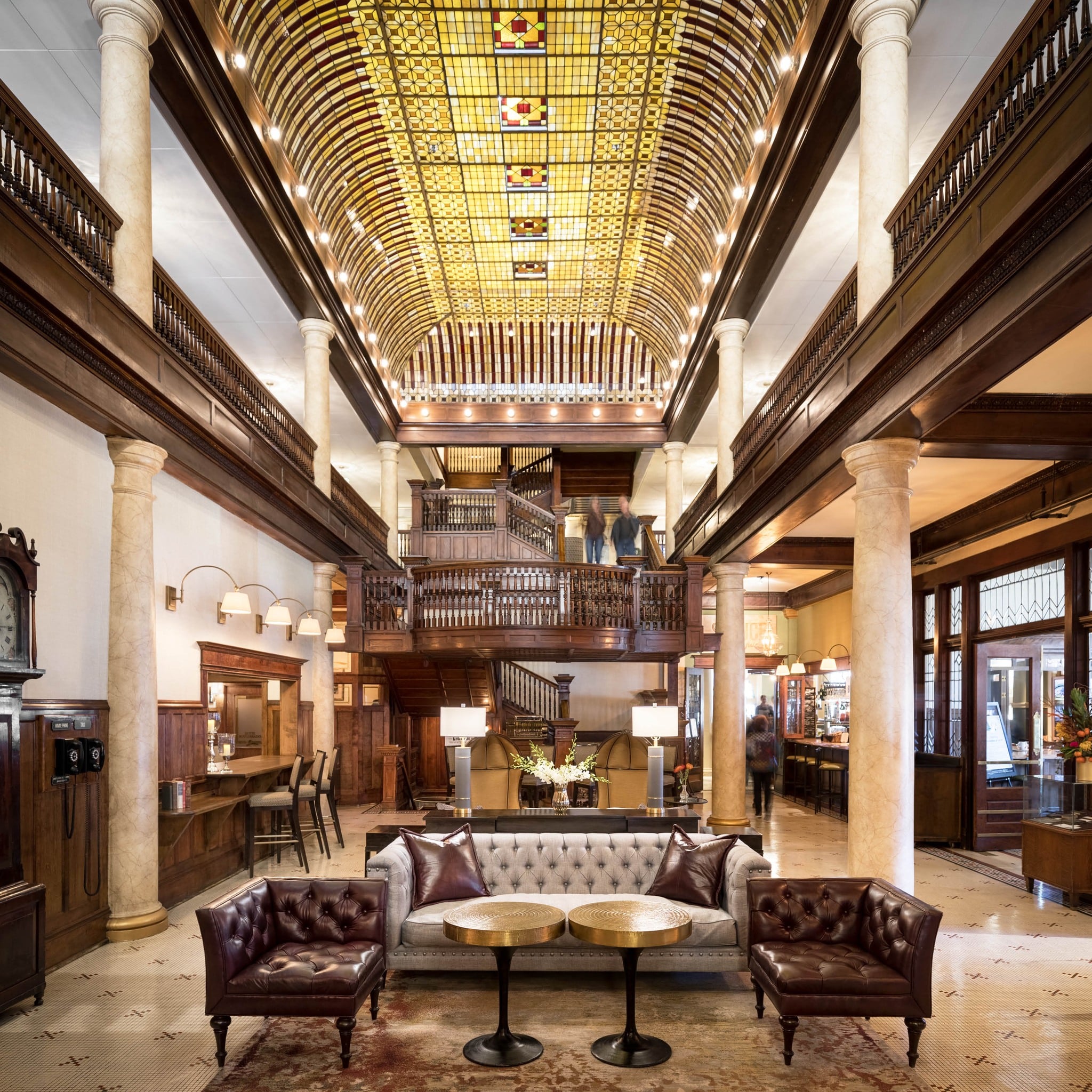 Large hotel lobby with high rise ceilings and historic furniture