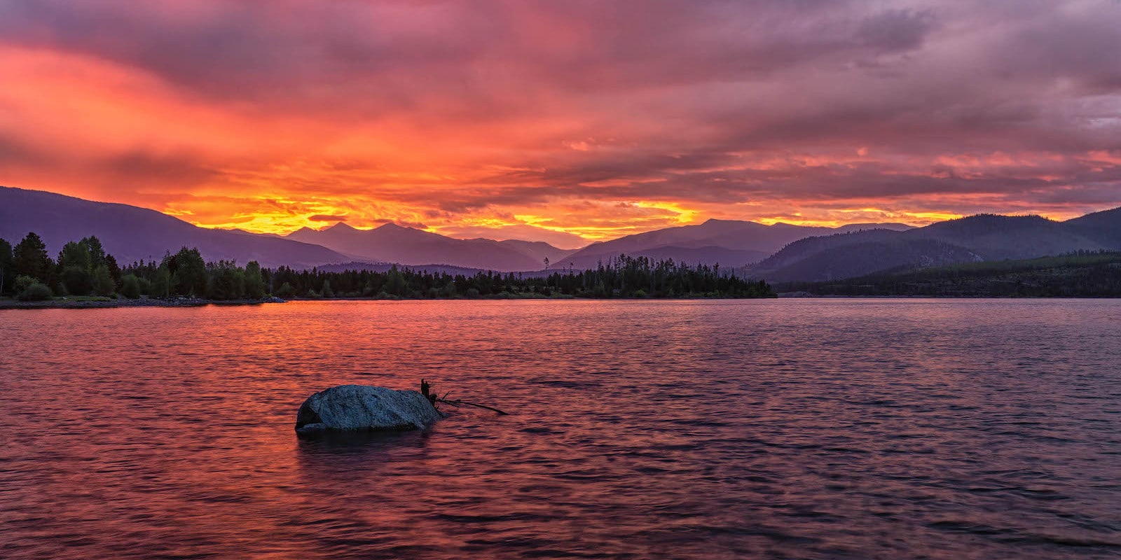 Sunrise with pink sky over the Dillon Reservoir, Colorado