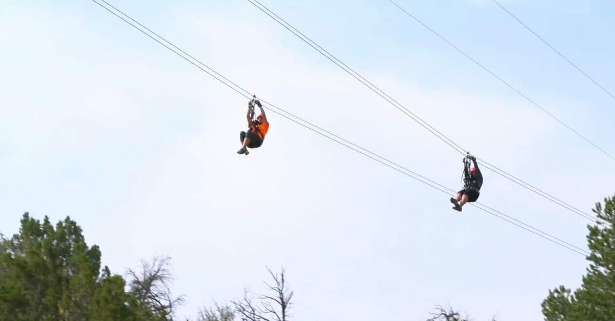 Two people on a dual-racing zipline at Royal Gorge Zipline Tours