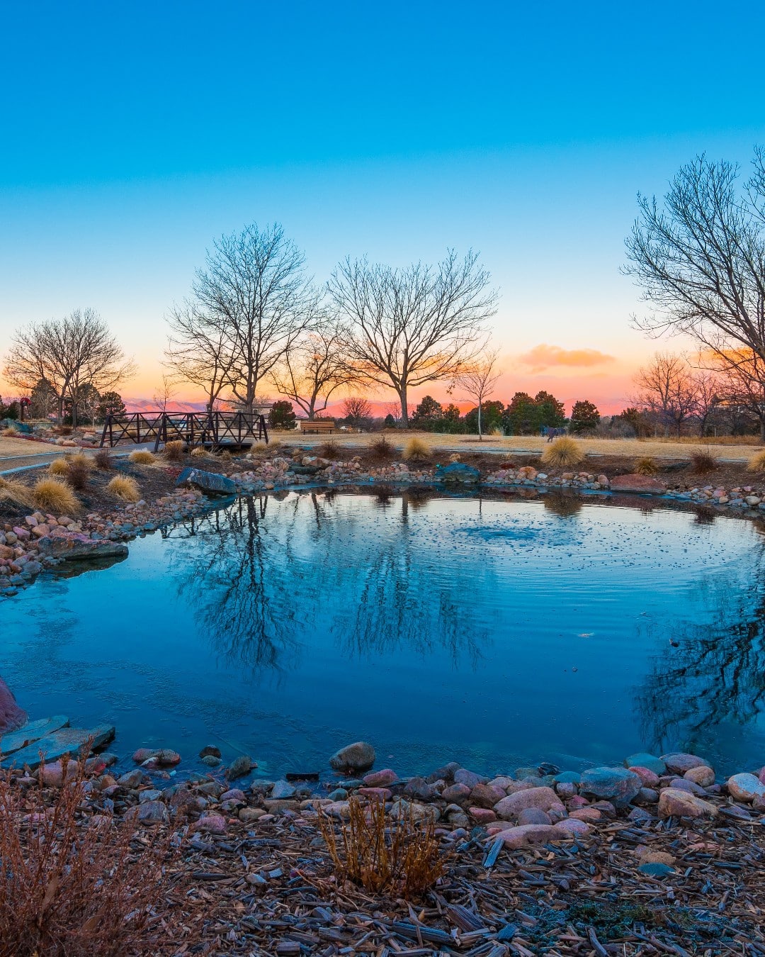 Sunset over a small pond at a town park