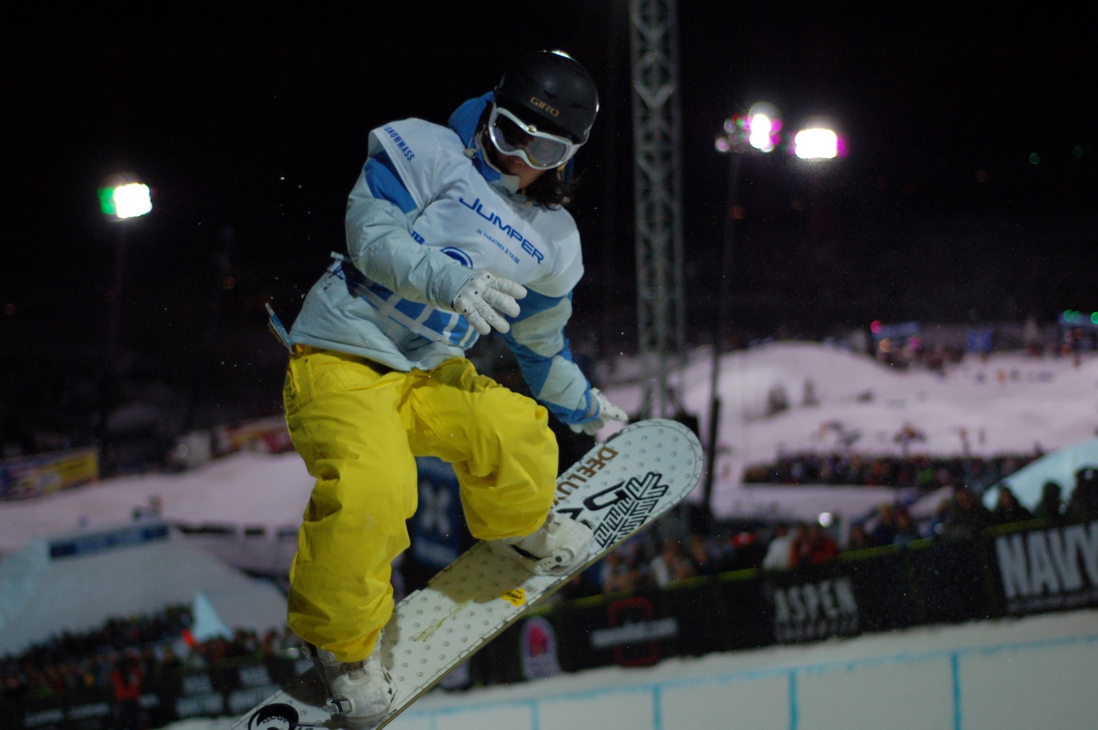 Snowboarder grabs the front of his board at Winter X Games Aspen CO