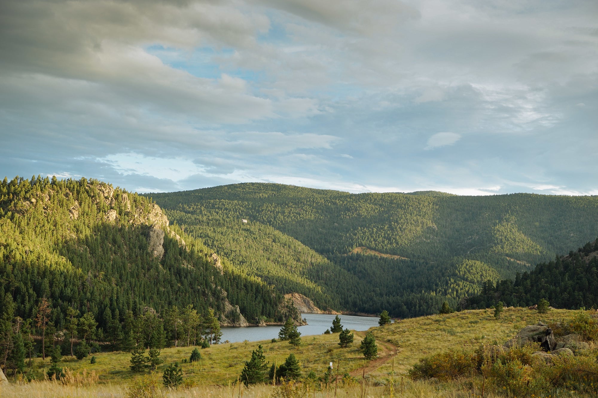 Lake surrounded by lush green mountains